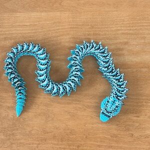 Blue, Black, and White Articulated Snake